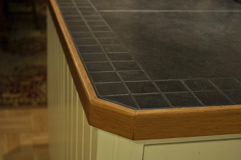 Kitchen worktops made of floor tiles and oak.