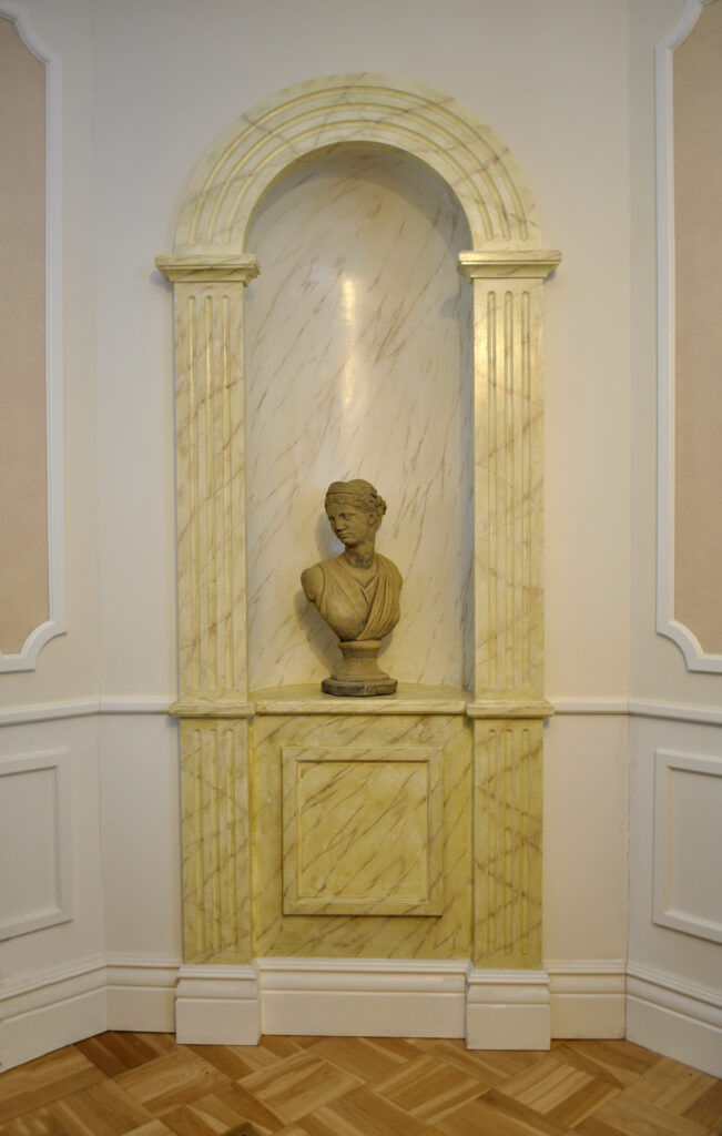 Classical niche made from wood, painted for marble look.