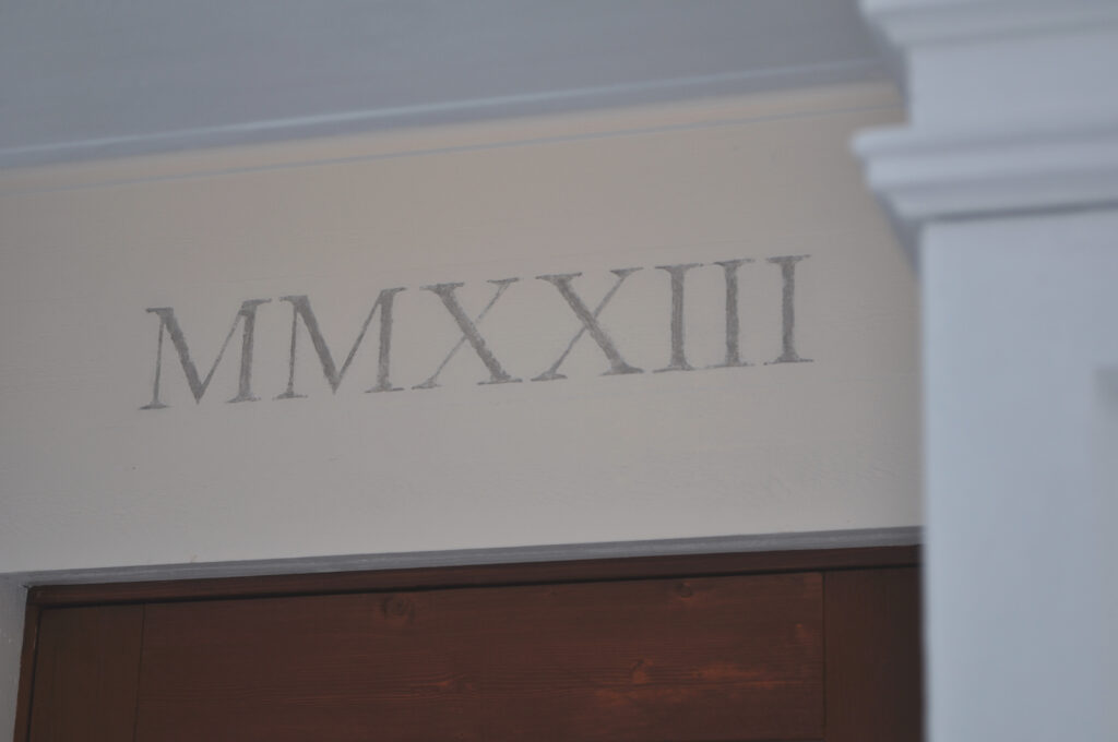 Carved Roman numerals showing the year of manufacture.